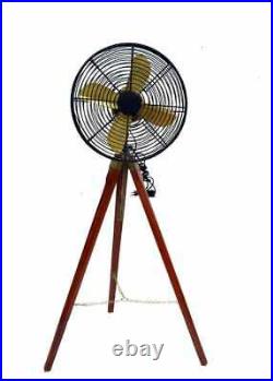 Antique electric fan with wooden tripod stand